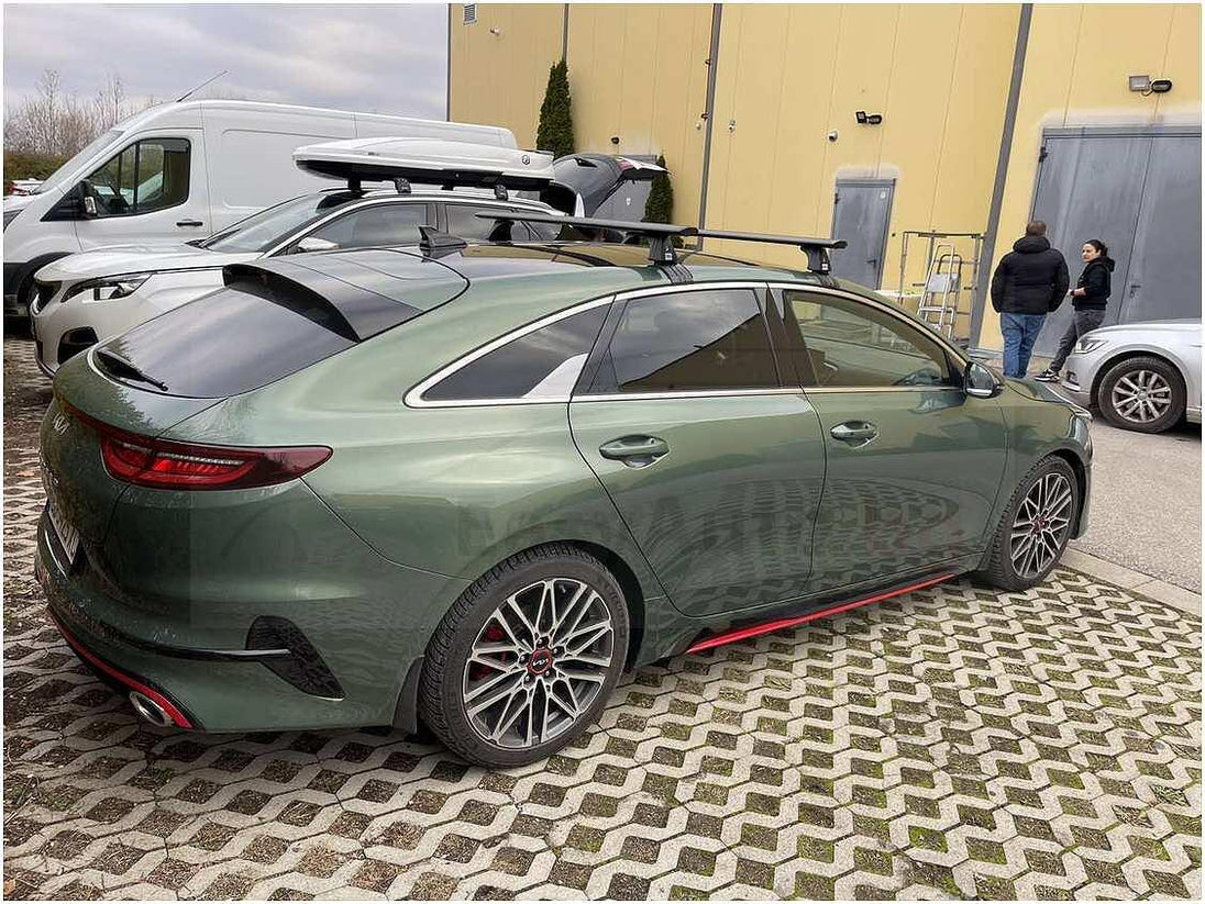 Черни аеродинамични алуминиеви греди Cruz Airo Dark T за Kia Pro Ceed комби без надлъжни греди на тавана