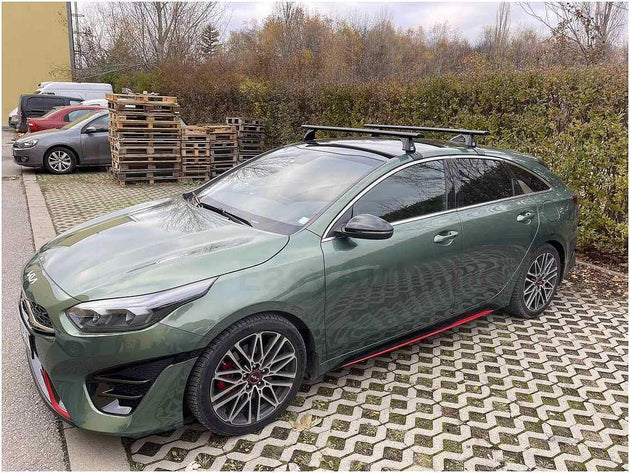 Черни аеродинамични алуминиеви греди Cruz Airo Dark T за Kia Pro Ceed комби без надлъжни греди на тавана